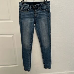 Buckle black skinny jeans